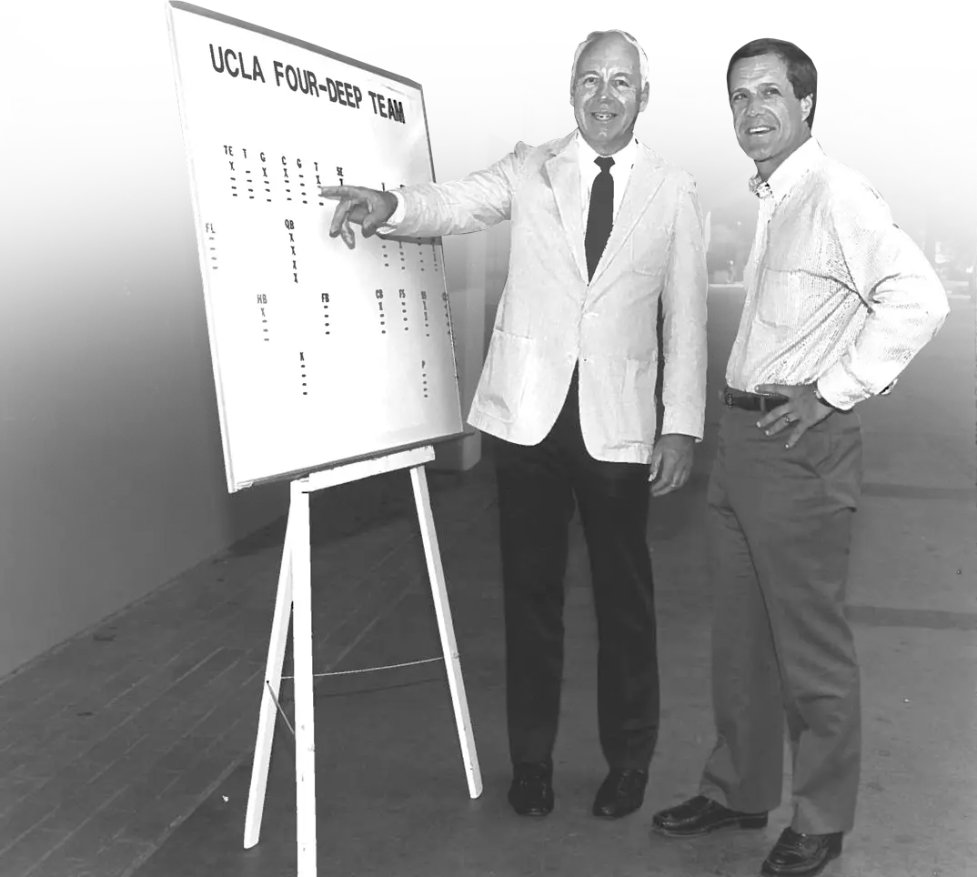 Coaches looking at strategy board