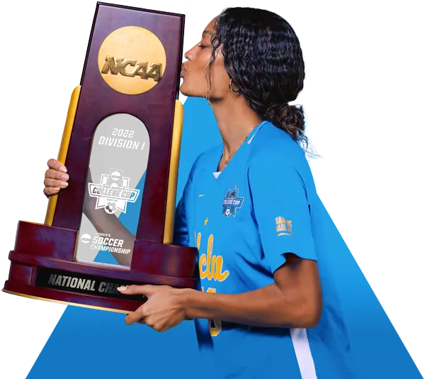 Student-athlete kissing trophy
