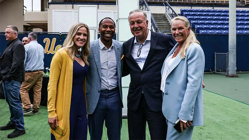 Two men and two women posing for a picture
